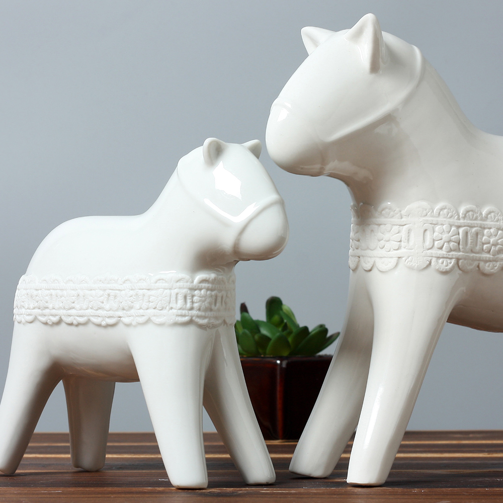 white ceramic horse statue