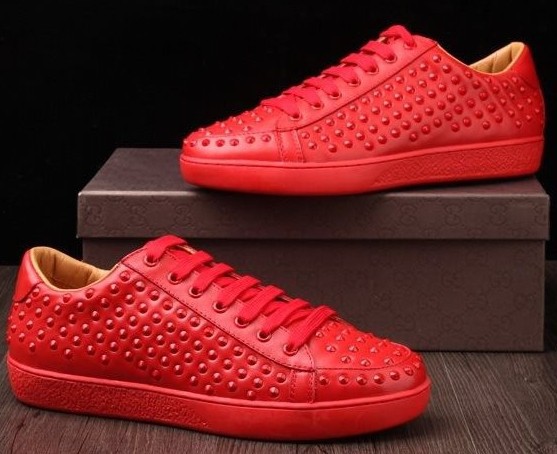 red bottom spiked sneakers