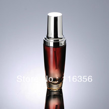 100ml red glass lotion bottle with silver pump for Cosmetic Packaging