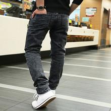 Free shipping 2015 Spring new men s black skinny jeans Fashion slim fit snowflake cowboy feet