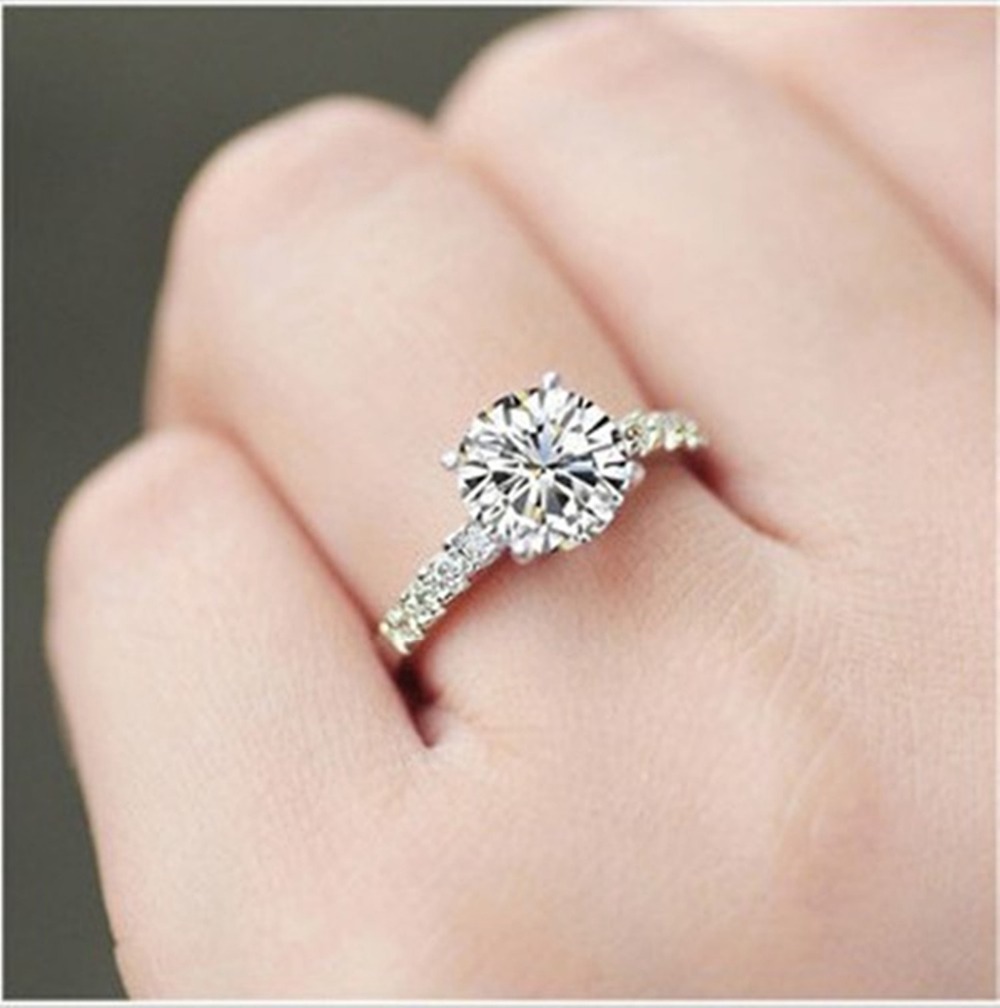 Round diamond solitaire engagement ring in sterling silver